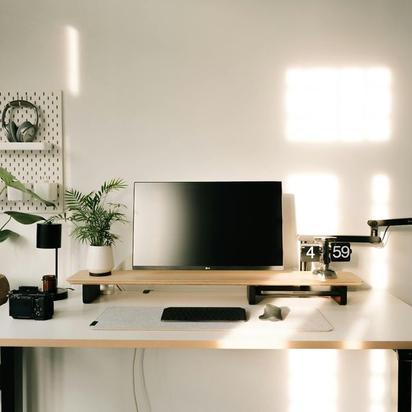 Minimalist desk setup with amber lighting and clean lines